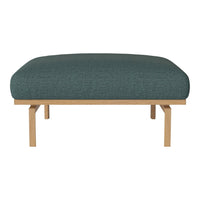 Teal upholstered ottoman with a textured fabric, featuring natural wood legs for a modern, minimalist look.