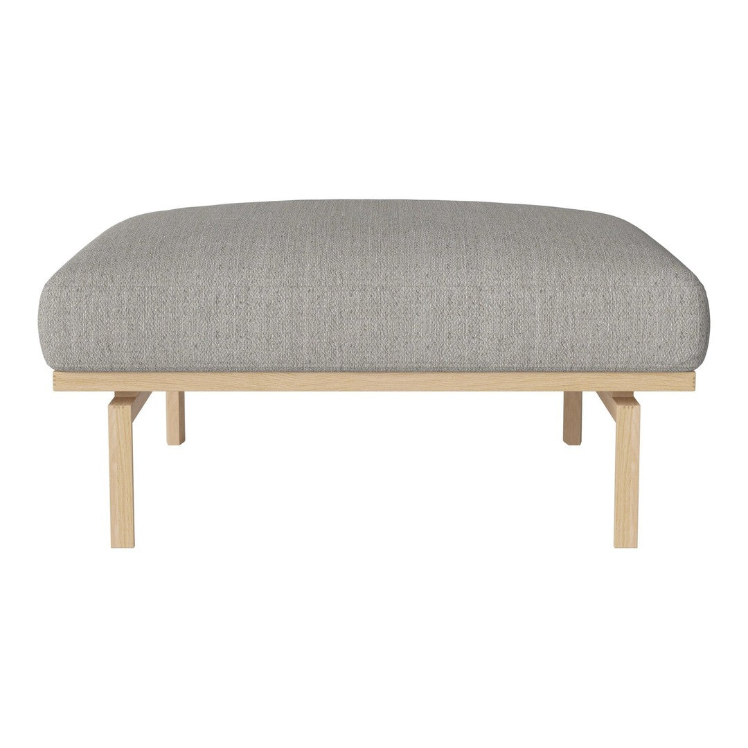 Gray textured upholstery on a minimalist wooden bench with clean lines and natural finish.