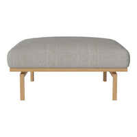 Light gray upholstered ottoman with subtle textured pattern, supported by natural wood legs. Perfect for modern decor.