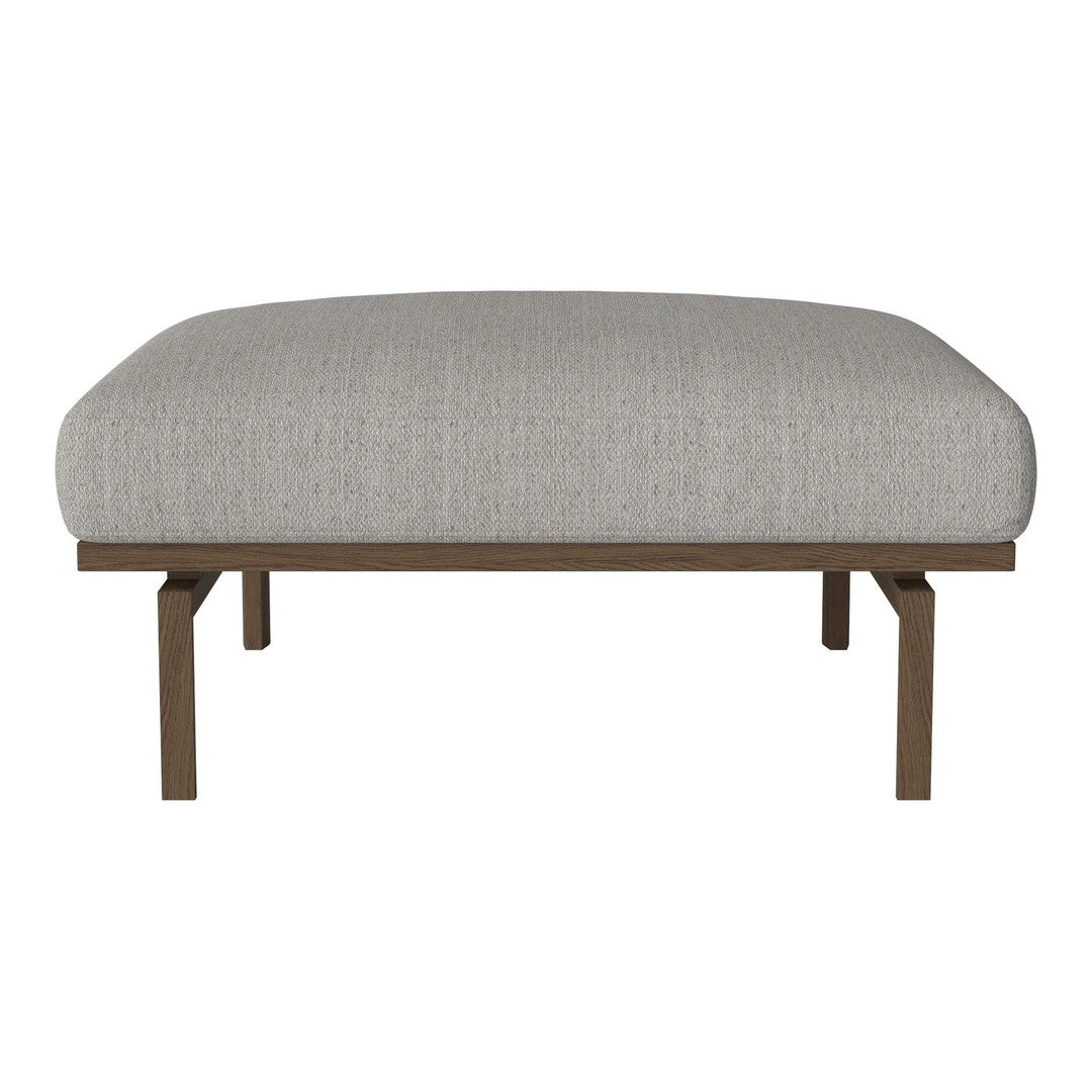 Light gray upholstered ottoman with textured fabric and a sleek wooden base. Perfect for modern decor.