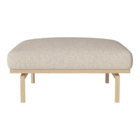 Beige upholstered ottoman with a smooth texture atop light wood legs, ideal for modern décor.