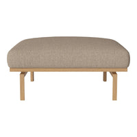 Neutral beige upholstered cushion with a smooth texture on a light wooden frame. Simple, modern design.