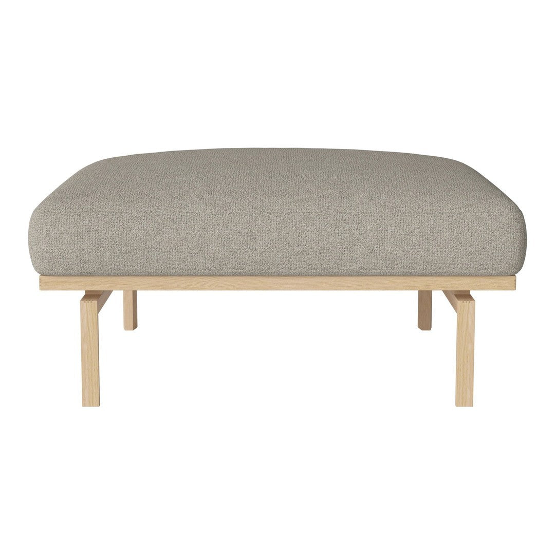 Light gray upholstered ottoman with a smooth, textured finish on a natural wood frame.
