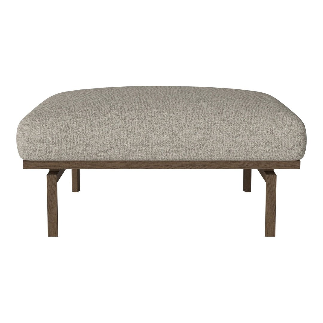 Beige cushioned ottoman with a smooth, textured fabric and sleek brown metal legs. Perfect for modern decor.