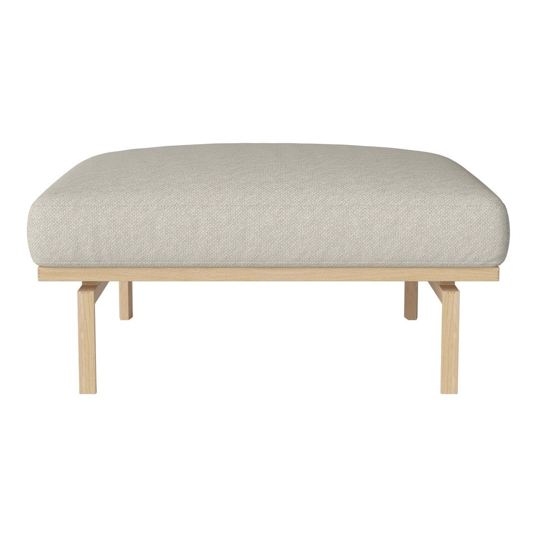Light beige upholstered ottoman with a smooth, rounded top and natural wood legs, offering a minimalist design.
