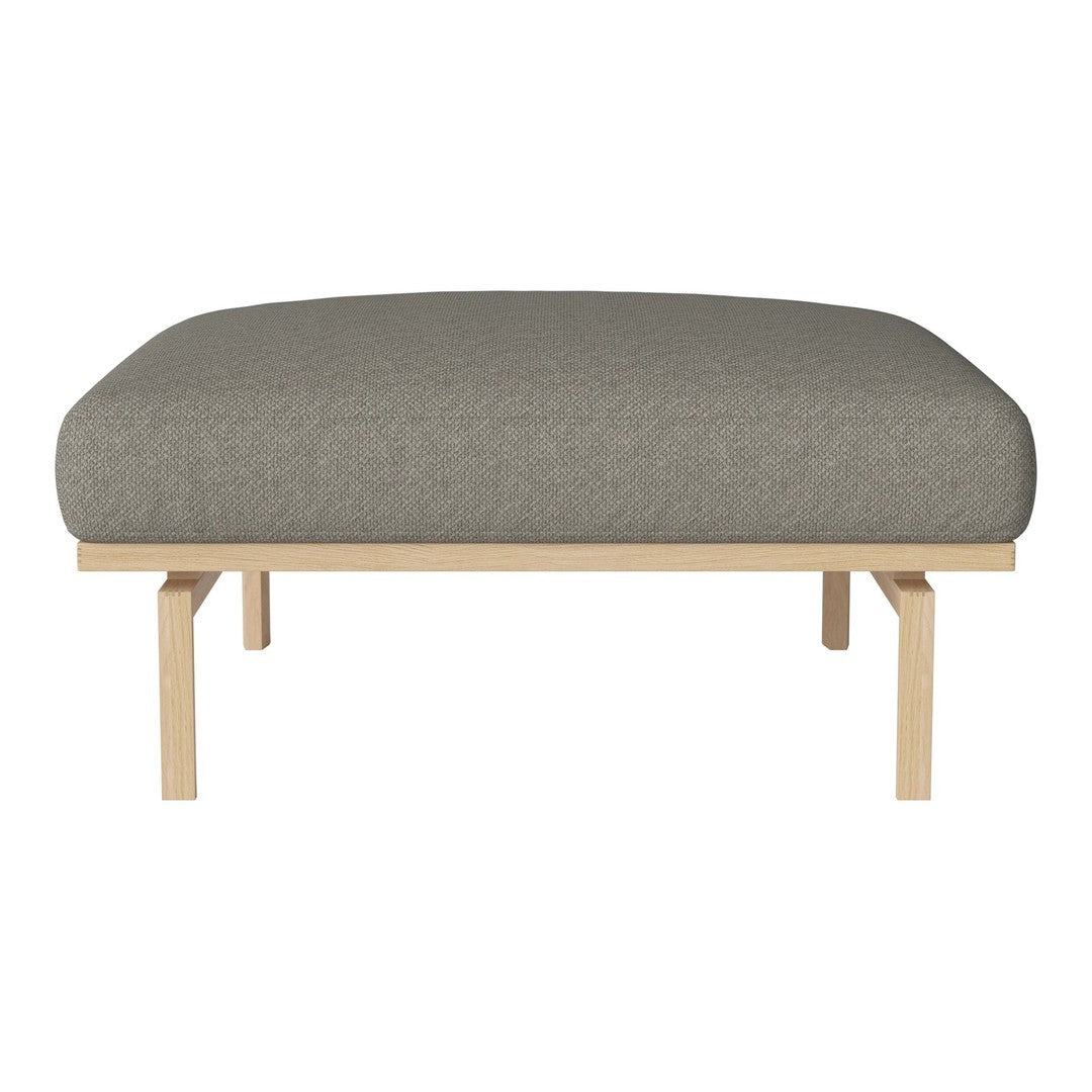 Gray upholstered ottoman with a smooth, rounded top and natural wooden legs. Minimalist design for a modern look.