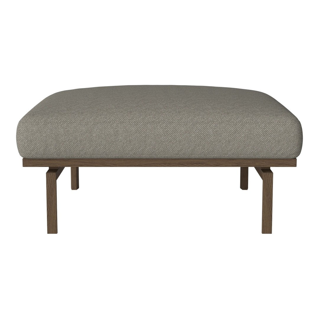 Gray upholstered ottoman with a smooth surface and minimalist brown wooden legs. Perfect for modern decor.