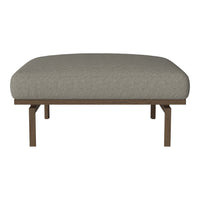 Gray upholstered ottoman with a smooth surface and minimalist brown wooden legs. Perfect for modern decor.