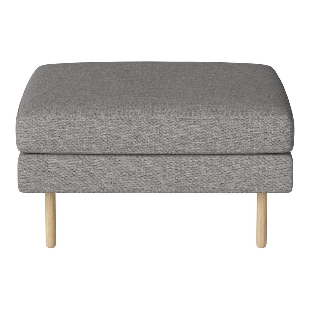 Gray upholstered ottoman with minimalist design and light wooden legs, perfect for modern decor.