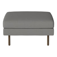 Gray upholstered ottoman with a smooth texture and wooden legs, perfect for modern decor.