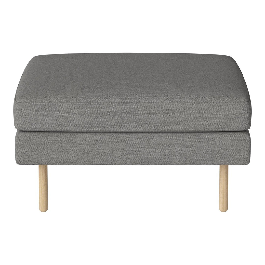 Gray cushioned ottoman with a textured fabric and light wooden legs, perfect for modern decor.