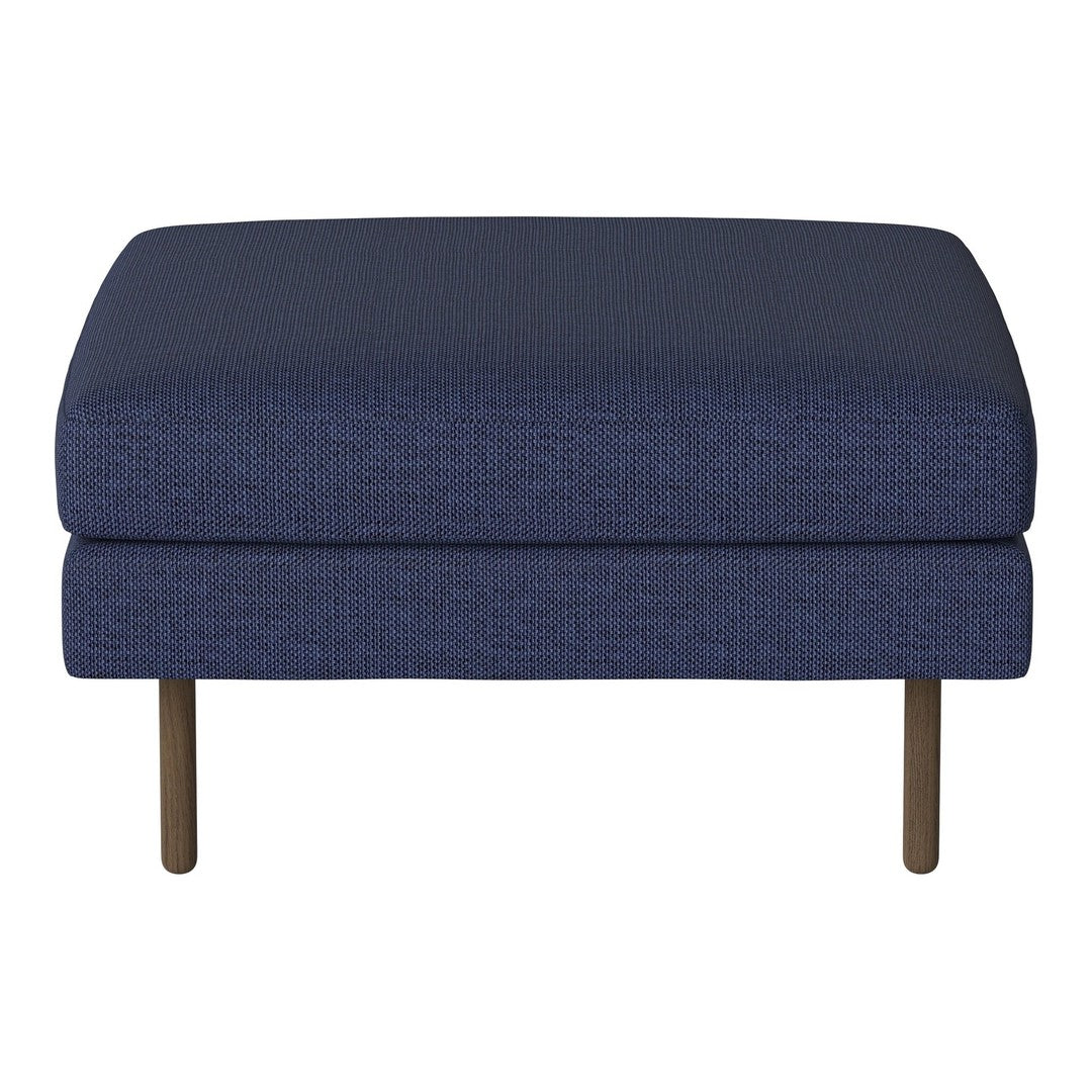 Navy blue ottoman with a textured pattern and sleek metal legs, perfect for modern home decor.