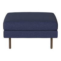 Navy blue upholstered ottoman with a textured pattern and sleek metal legs, perfect for modern decor.