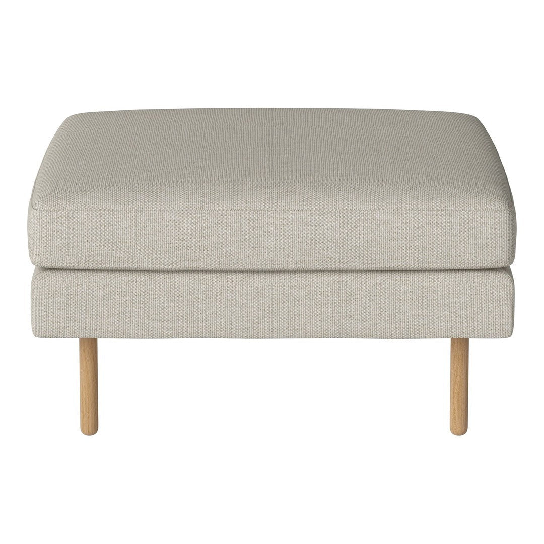 Light beige upholstered ottoman with a smooth texture and light wood legs, perfect for versatile decor.