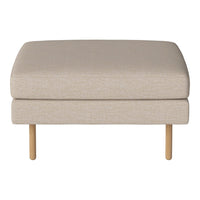 Beige ottoman with a smooth texture and light wooden legs, perfect for modern interiors.
