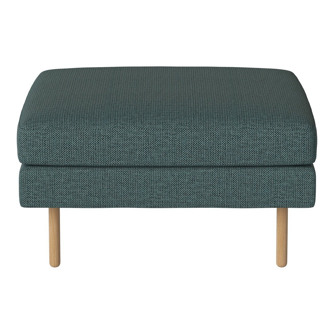 Teal textured ottoman with natural wooden legs, featuring a minimalist design and a sleek, modern aesthetic.