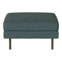 Teal upholstered ottoman with a subtle textured pattern and wooden legs, ideal for modern decor.