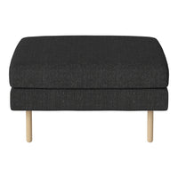 Black upholstered ottoman with a smooth texture and light wooden legs. Minimalist design with a contemporary feel.