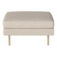 Beige upholstered ottoman with a subtle textured pattern, featuring light wood legs. Minimalist design for any decor.