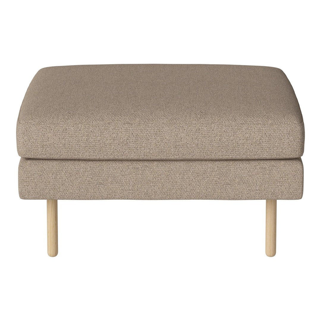Beige upholstered ottoman with a smooth texture and natural wood legs, perfect for modern decor.