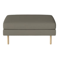 Gray upholstered ottoman with a smooth texture and natural wood legs, perfect for stylish home decor.