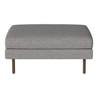 Gray upholstered ottoman with a sleek design and minimalist pattern, complemented by metal legs.