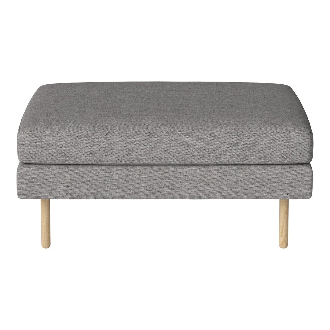 Gray upholstered ottoman with a smooth texture and light wooden legs. Versatile and modern design for any space.