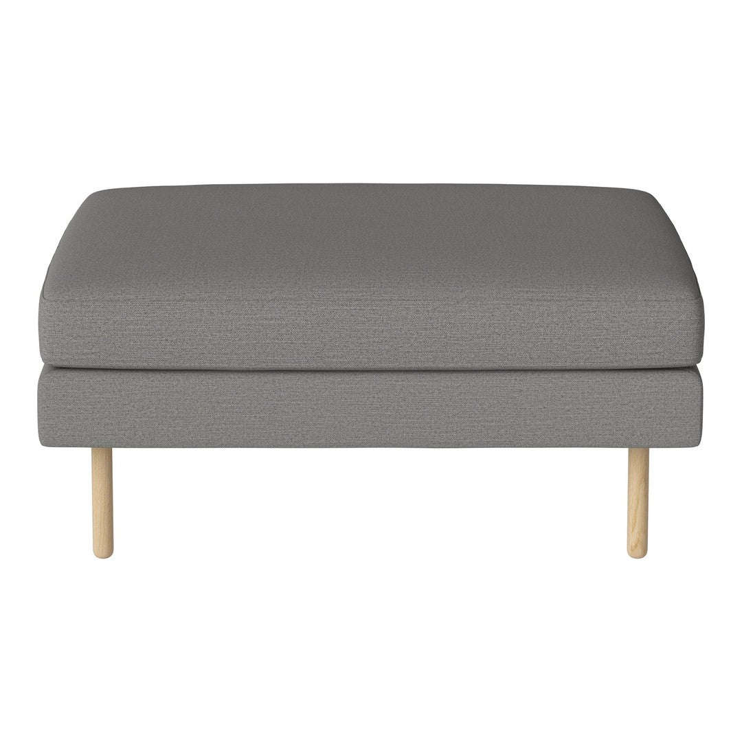 Gray upholstered ottoman with a smooth surface and light wooden legs, offering a modern, minimalist design.