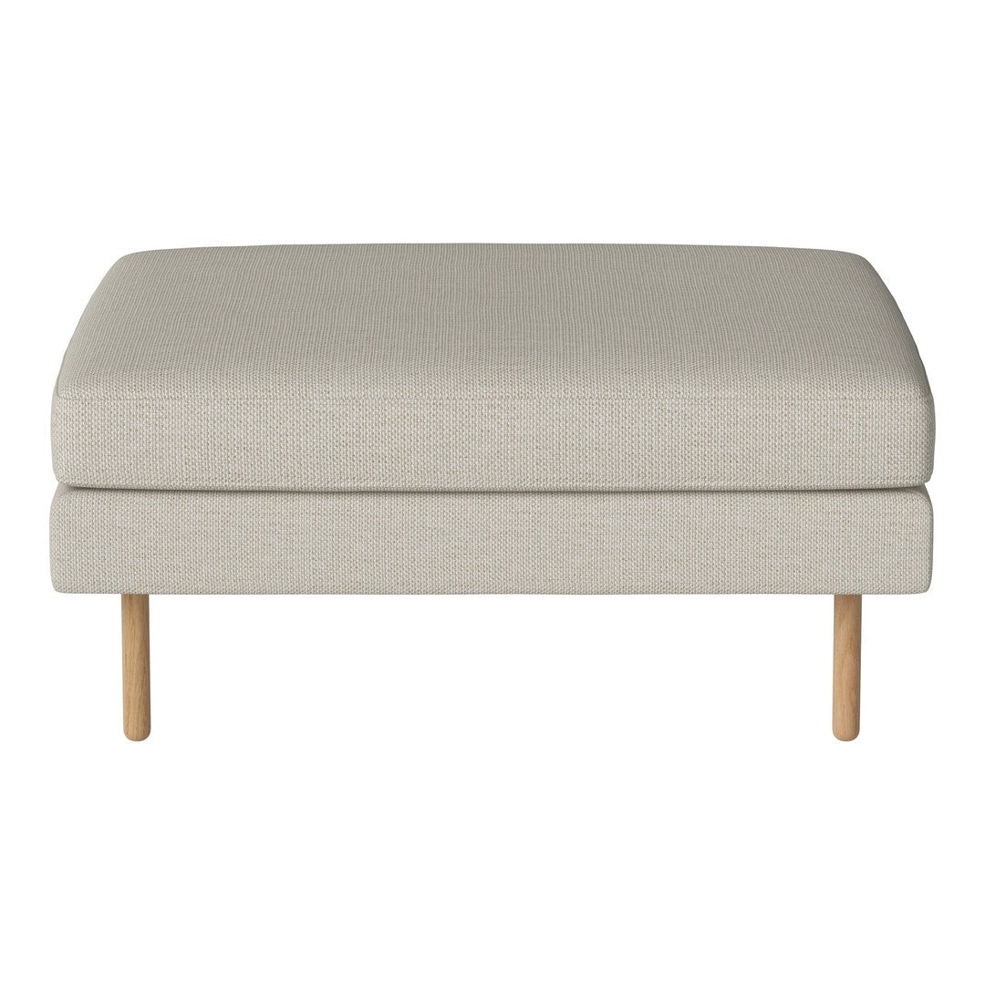 Light beige upholstered ottoman with a smooth texture and natural wood legs, perfect for modern decor.