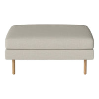 Light beige upholstered ottoman with a smooth texture and natural wood legs, perfect for modern decor.