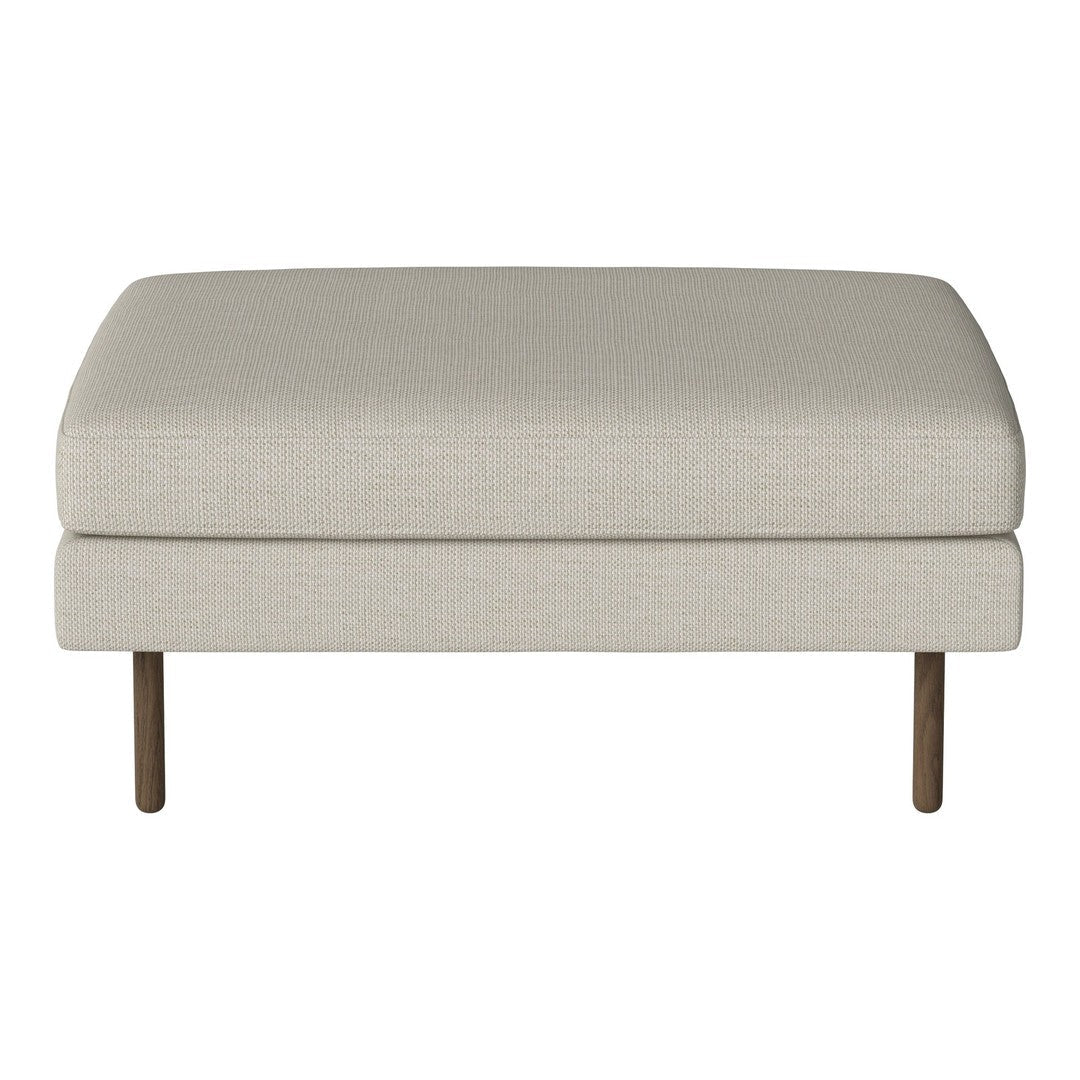 Beige upholstered ottoman with a smooth, solid surface and wooden legs, perfect for adding a neutral touch to any space.