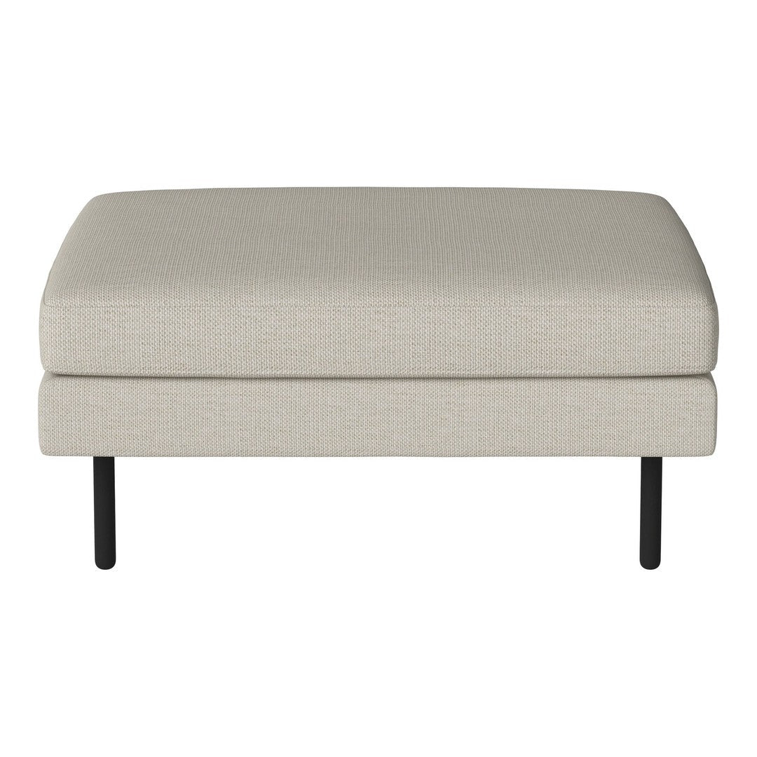 Light beige ottoman with a smooth texture and black metal legs, perfect for modern decor.
