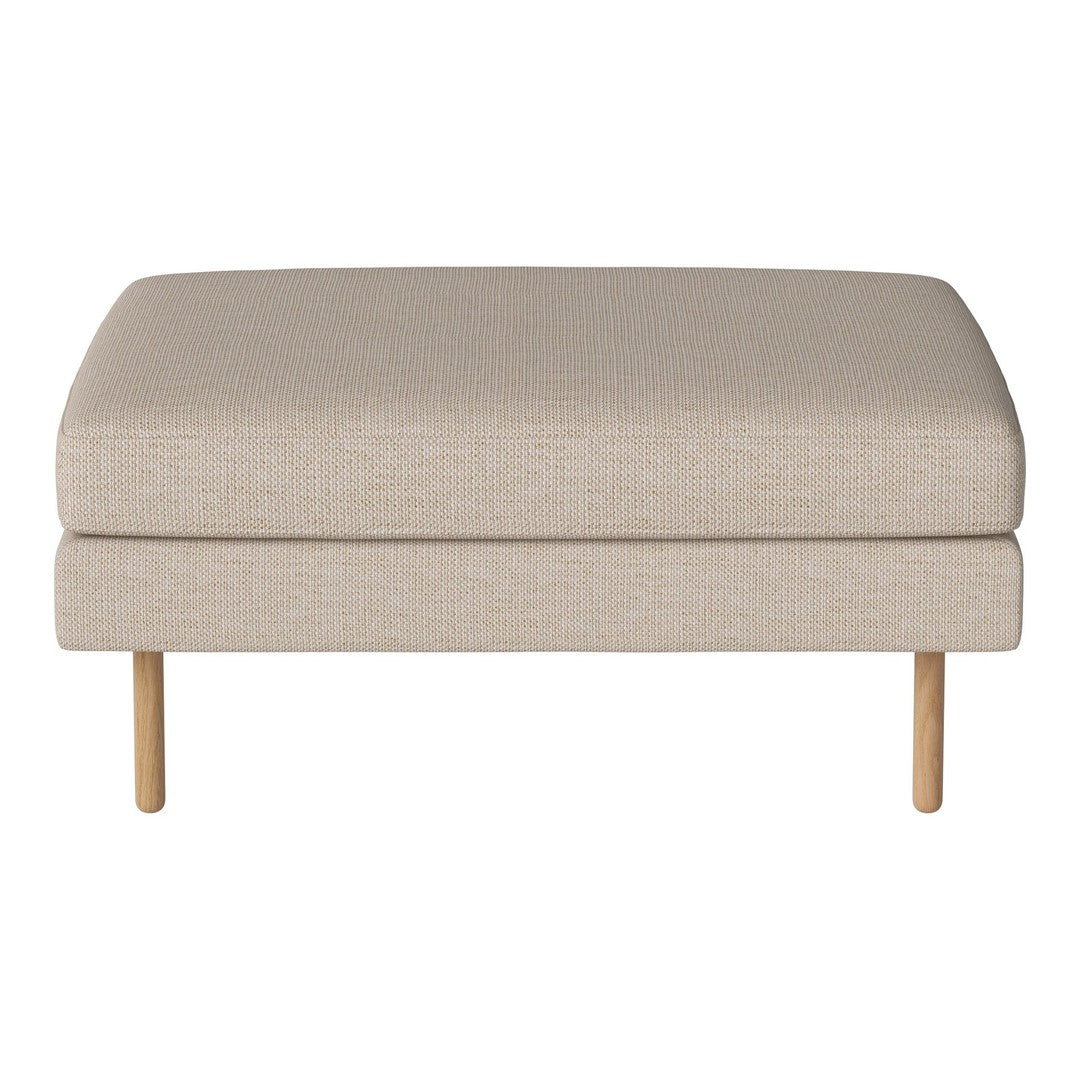 Beige upholstered ottoman with smooth texture and light wood legs. Ideal for modern living spaces.