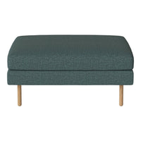 Teal upholstered ottoman with a textured fabric and light wooden legs. Ideal for modern and cozy interiors.