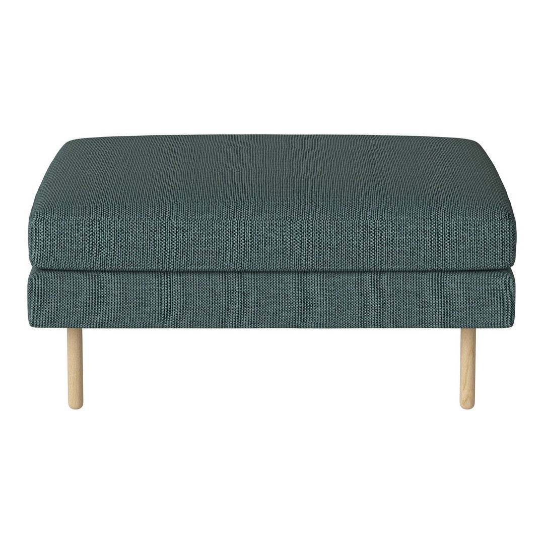 Teal upholstered ottoman with textured fabric and light wood legs, ideal for modern decor.