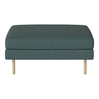 Teal upholstered ottoman with textured fabric and light wood legs, ideal for modern decor.