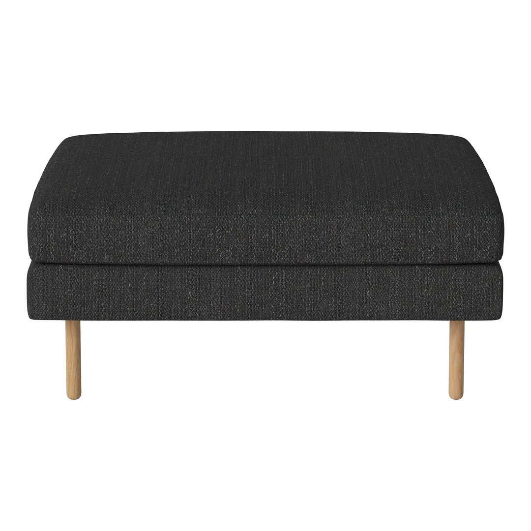 Dark gray upholstered ottoman with a smooth texture and natural wood legs. Stylish, modern addition to any decor.