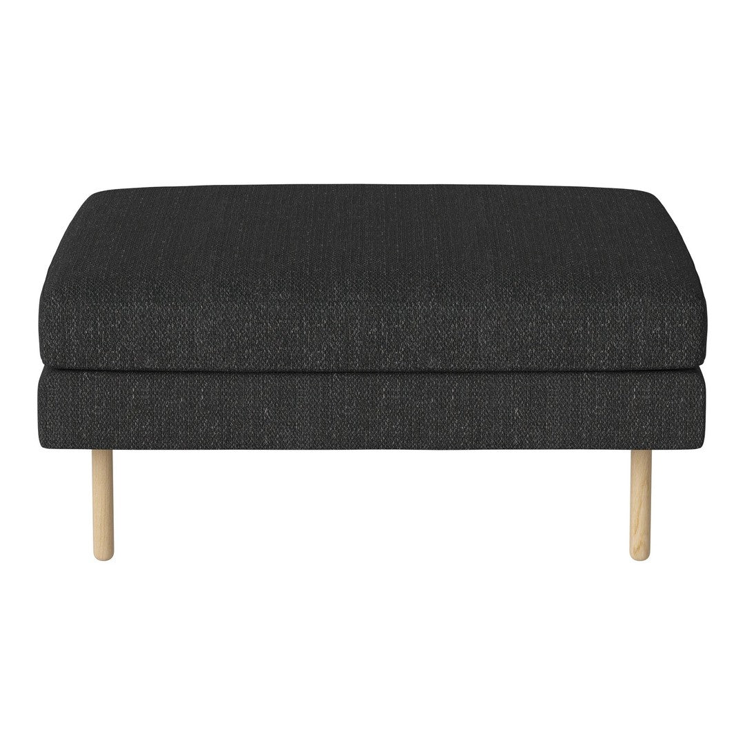 Dark gray upholstered ottoman with a textured fabric and light wooden legs, adding a modern touch to any space.