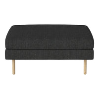 Dark gray upholstered ottoman with a textured fabric and light wooden legs, adding a modern touch to any space.
