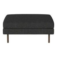 Dark gray upholstered ottoman with a textured fabric and sleek metal legs, adding modern elegance to any space.