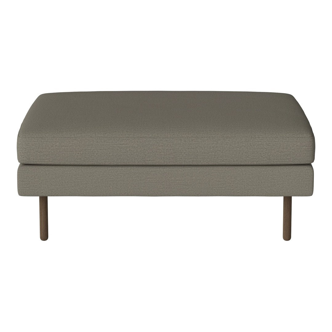 Gray upholstered ottoman with a smooth texture and minimalist design, featuring wooden legs. Perfect for modern interiors.