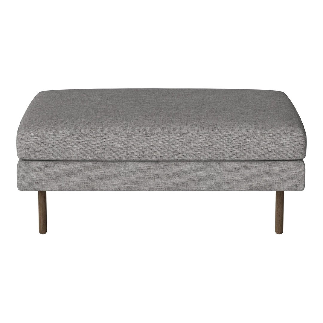 Gray upholstered ottoman with a sleek design and subtle texture, featuring minimalist metal legs.