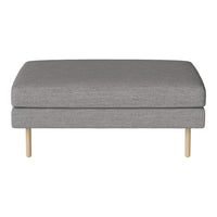 Gray upholstered ottoman with a smooth texture and natural wood legs. Minimalist design for modern interiors.