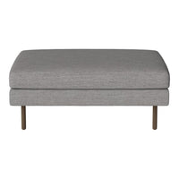 Gray upholstered ottoman with a smooth, minimalist design and metallic legs. Perfect for modern decor.