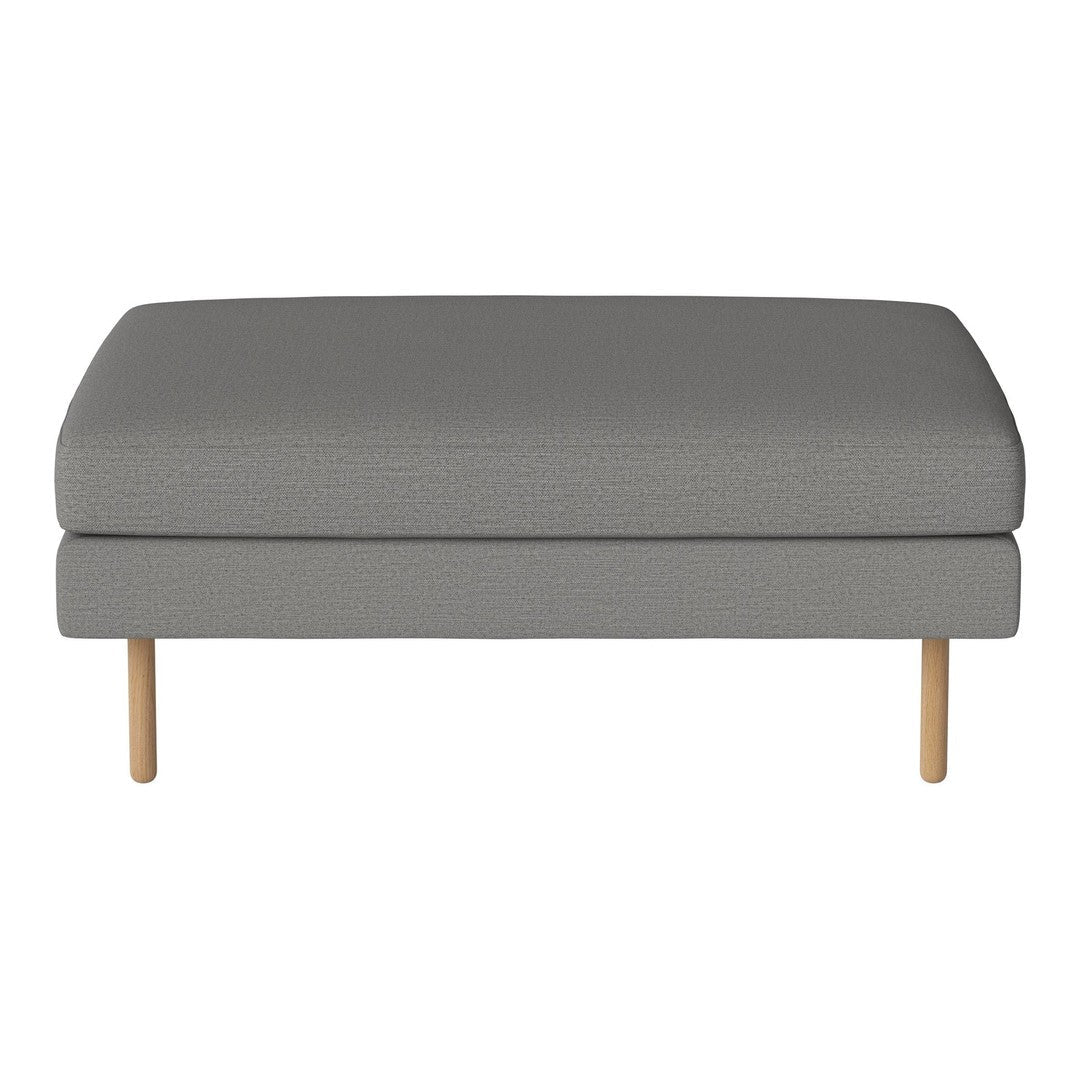 Gray upholstered ottoman with a textured pattern and natural wood legs, perfect for modern living spaces.