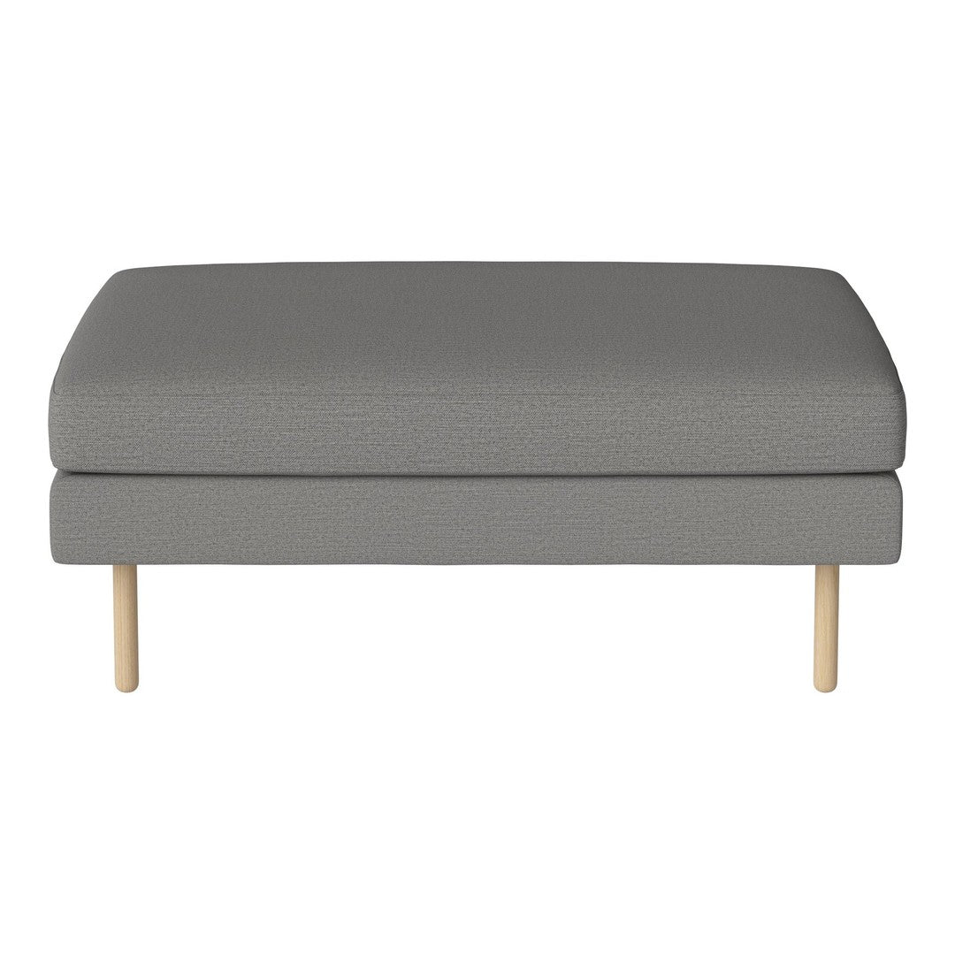 Gray upholstered ottoman with a subtle texture and light wooden legs. Perfect for modern decor.