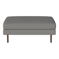 Gray upholstered ottoman with a sleek, minimalist design and subtle textured pattern. Stylish metal legs.
