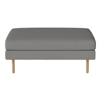 Gray upholstered ottoman with textured fabric and natural wood legs, ideal for modern decor.