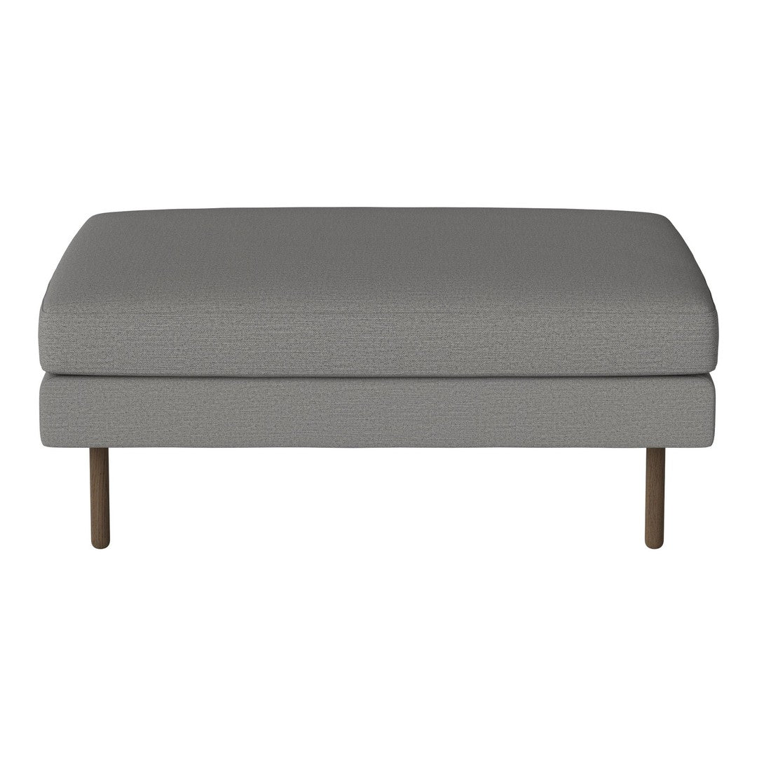 Gray upholstered ottoman with a smooth texture and minimalistic design, featuring metal legs for modern aesthetics.