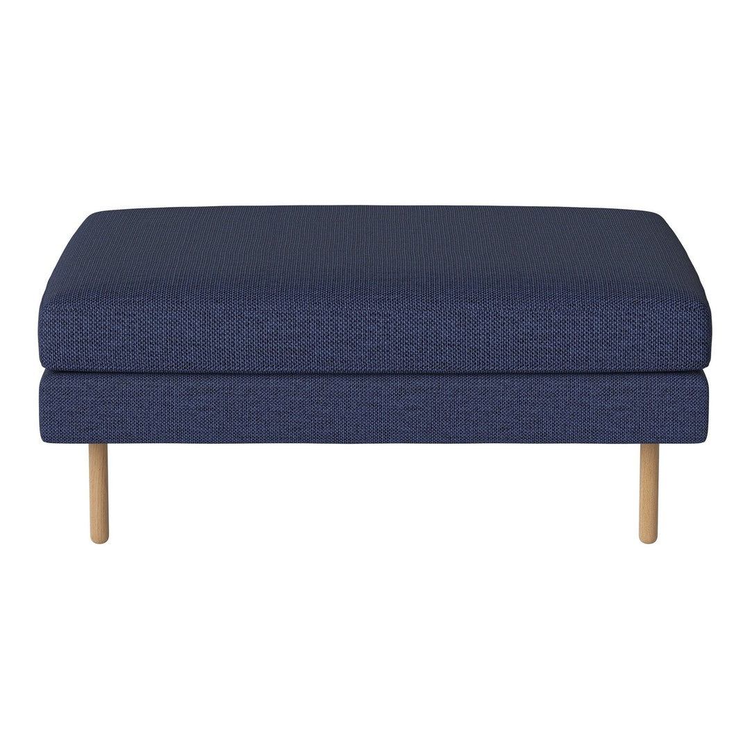 Navy blue upholstered ottoman with subtle texture and natural wood legs, perfect for modern living spaces.